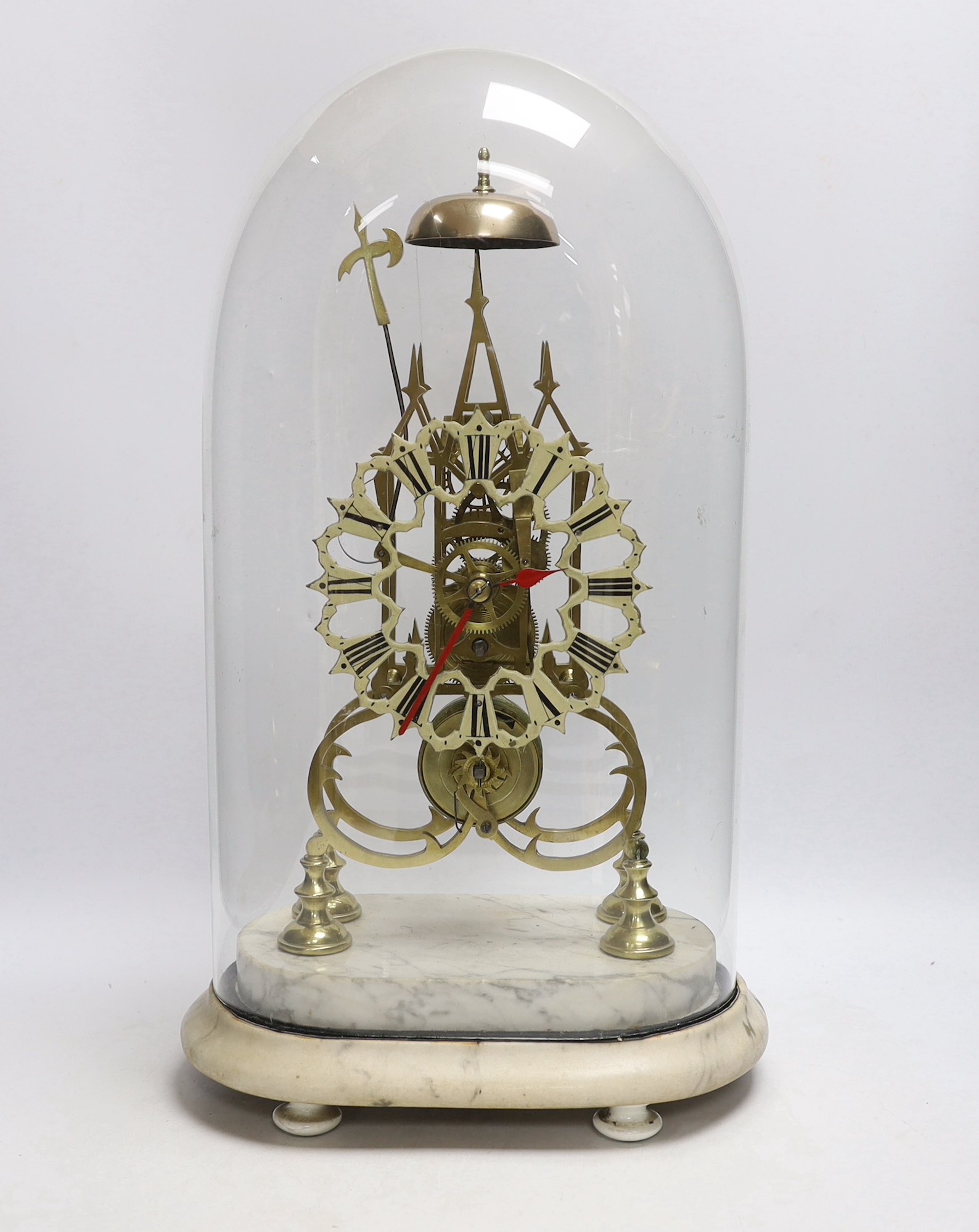 A 19th century brass skeleton clock under dome on shaped grey marble base, 49cm high